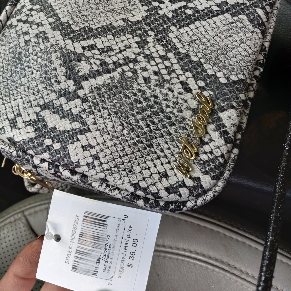 Small Black and white snake skin purse with a shoulder strap brand new with tag